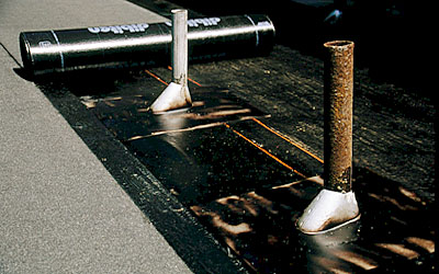 Pipe flashings, asphalt primer and torched down roofing