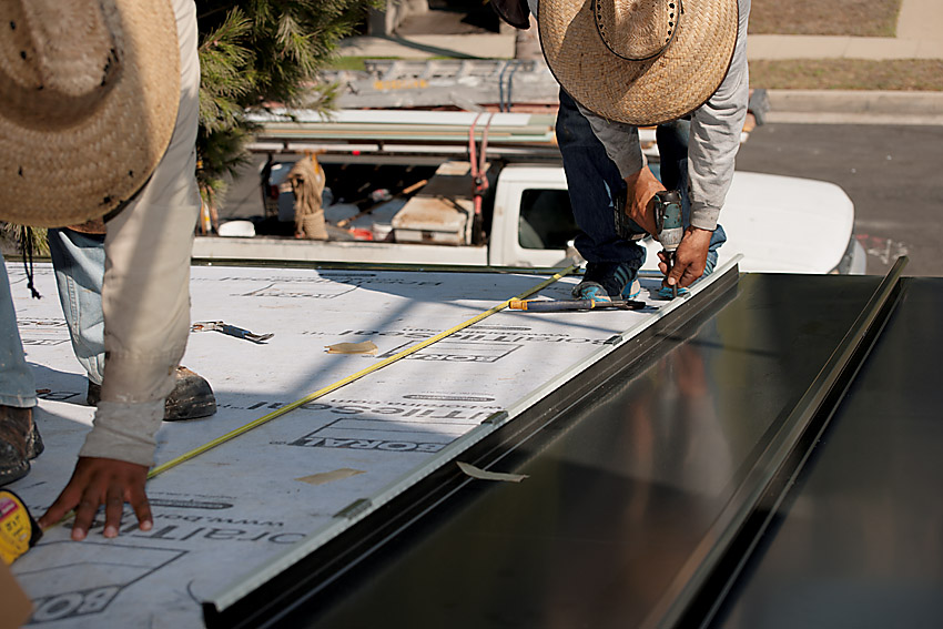 Measuring and installing metal roof panels