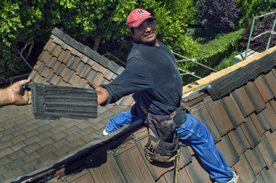 Roofer Installing Crown Tiles